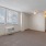 a room with a window and ceiling fan